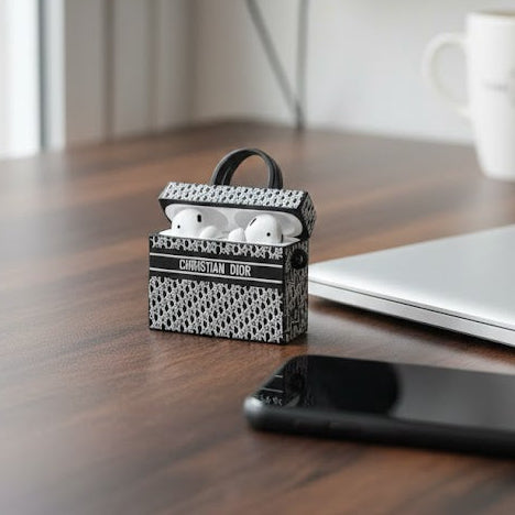 Small amplifier model on a desk with headphones and a laptop in the
